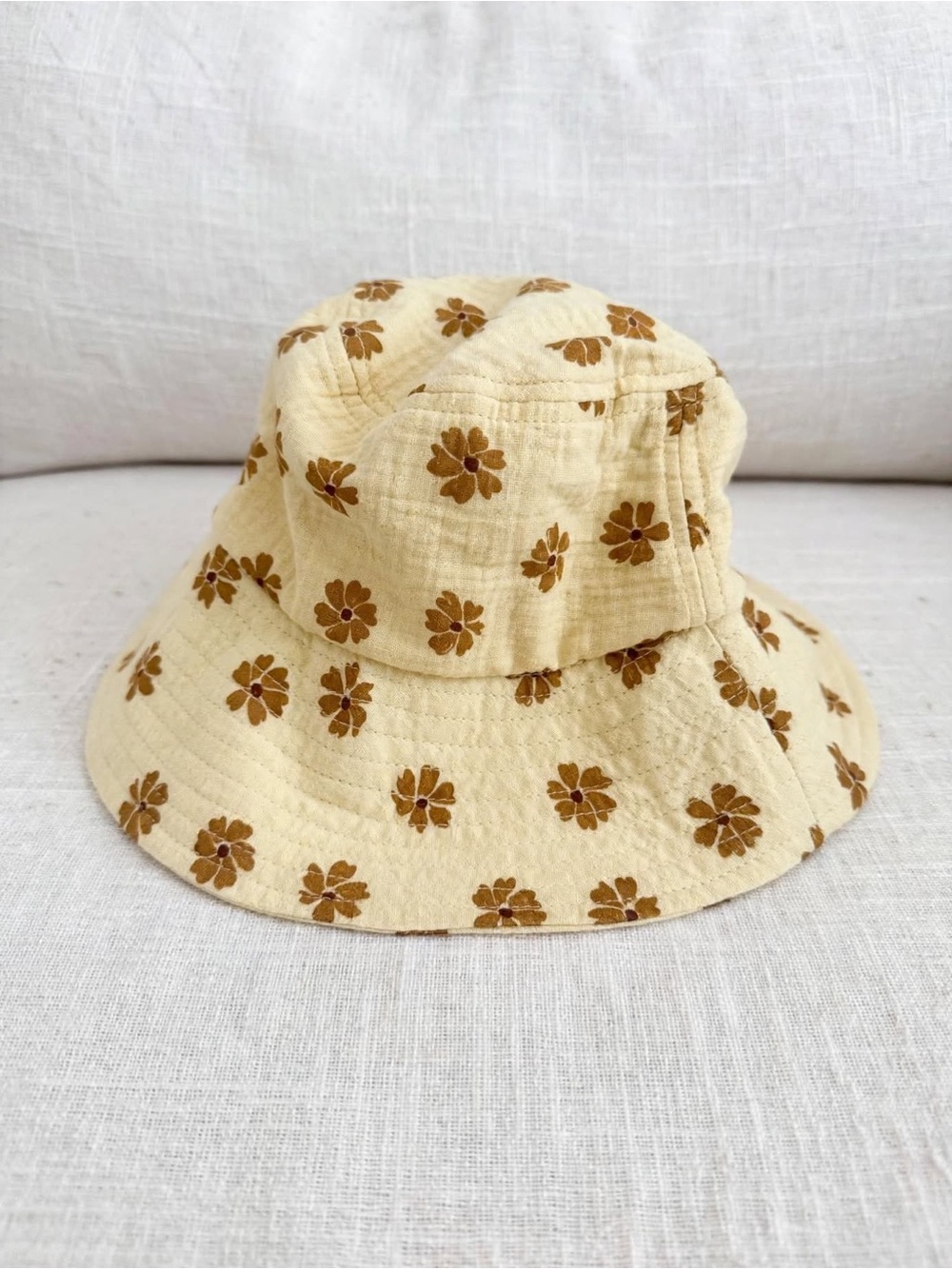 Kids Rylee + Cru  Bucket Hat in the butter yellow and retro brown daisy size S/M